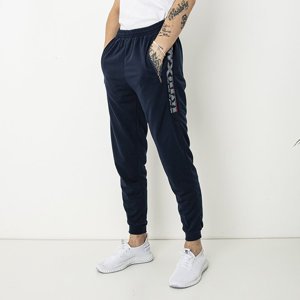 Granatowe męskie spodnie dresowe z napisami - Odzież