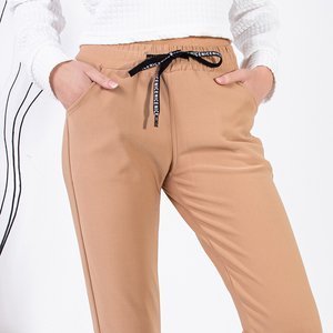 Jasnobrązowe damskie spodnie dresowe - Odzież