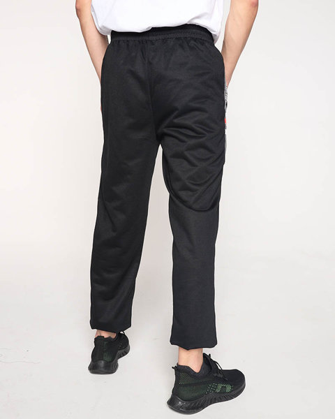 Męskie czarne spodnie dresowe z napisami - Odzież