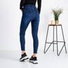 Niebieskie damskie spodnie jeansowe z przetarciami - Odzież