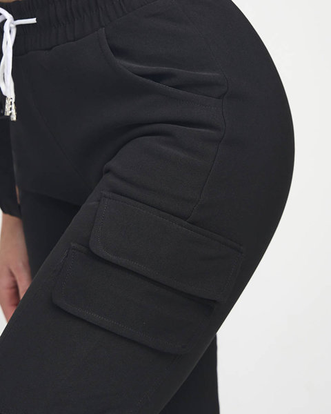 Ocieplane czarne damskie spodnie bojówki z ozdobami - Odzież