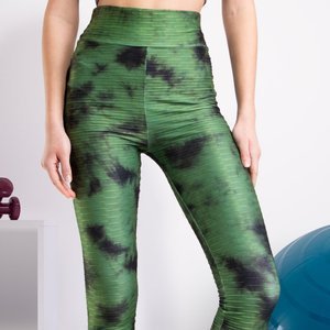 Zielone damskie legginsy w ozdobne plamki - Odzież