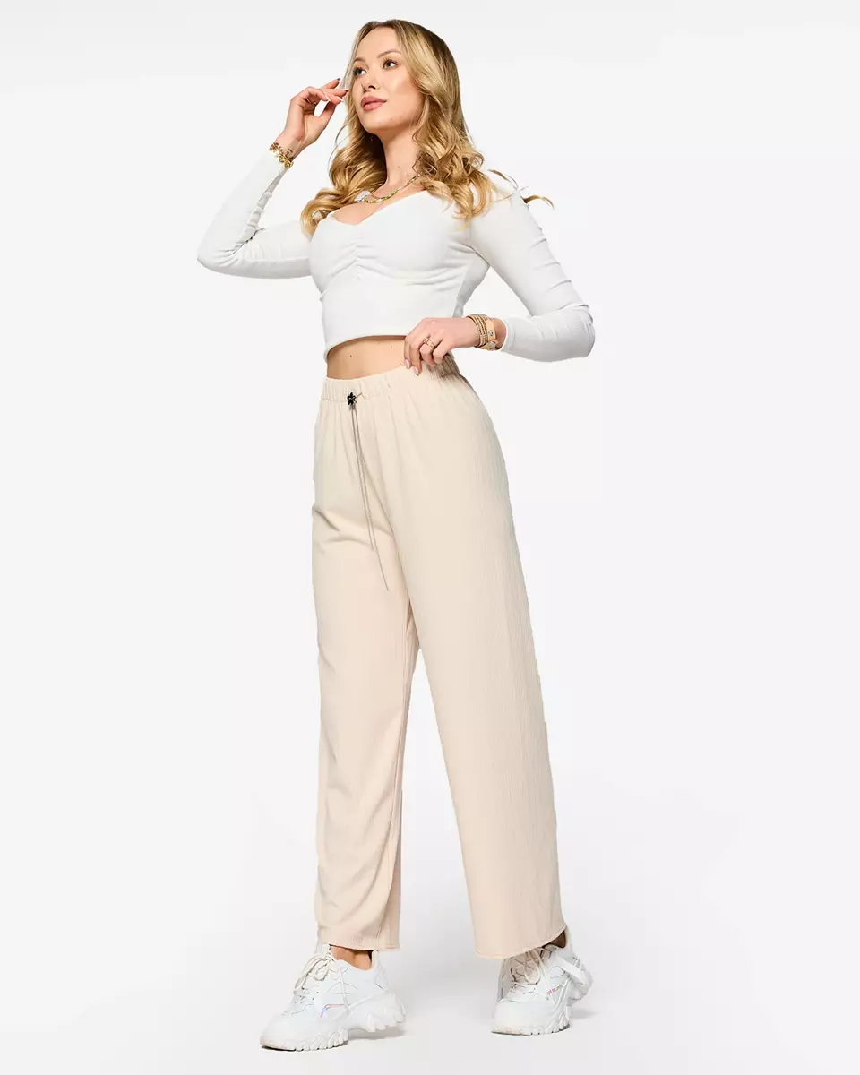 Бежеві жіночі широкі брюки в рубчик - Одяг